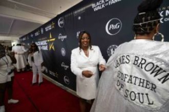James Brown honored at grand opening of Cincinnati's Black Music Walk of Fame, celebrating his legacy and Black music history.