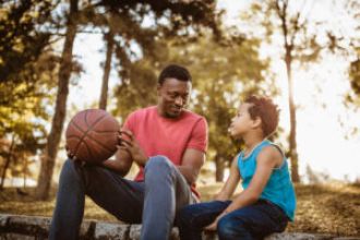 Black men often take on paternal roles to mentor younger generations, known as “otherfathering”.
