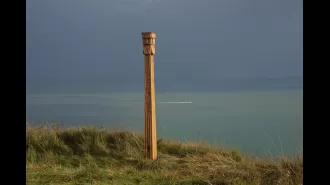 A mysterious totem pole with the name of a thunder god has been found along a coastal path.