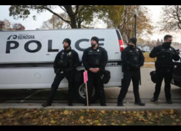 Officers in Kenosha seen using excessive force on an innocent Black man holding a baby in his arms.