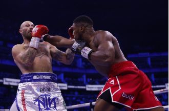 Anthony Joshua KO's Robert Helenius, ending the fight with a powerful punch.