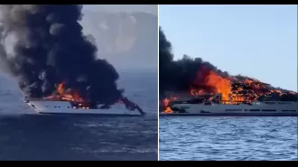 Yacht catches fire off Spanish coast, engulfed in flames.