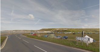 Nine people hurt when a car drove into a tent at a Welsh campsite.