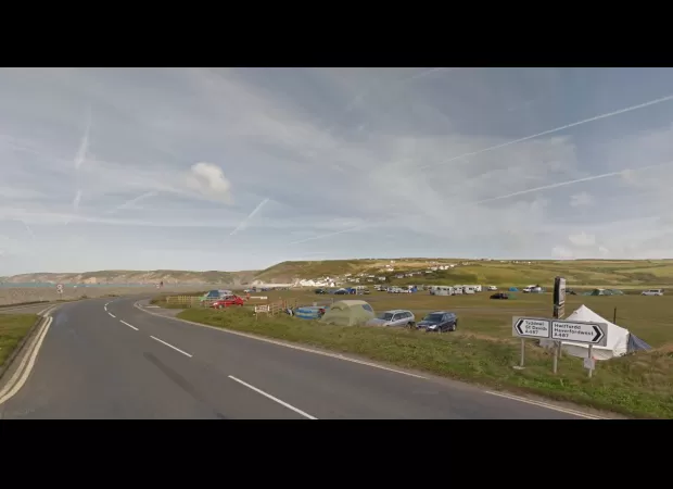 Nine people hurt when a car drove into a tent at a Welsh campsite.