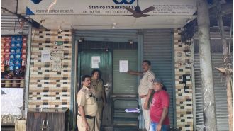 UP Police put court notice outside ex-SP leader's office as they pursue him for evading arrest.