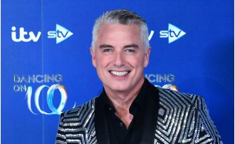 John hastens to ICU to support his ill mom, causing him to miss the event.