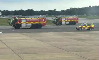 Fire engines rush to Gatwick Airport runway after flights are diverted.