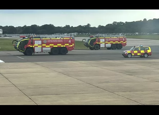 Fire engines rush to Gatwick Airport runway after flights are diverted.