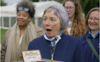 Guest overwhelmed to learn precious diamond brooch given incredible valuation on Antiques Roadshow.