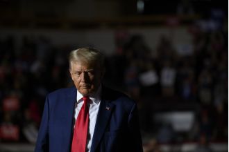 Trump agrees to pay $200K bond to surrender to authorities.