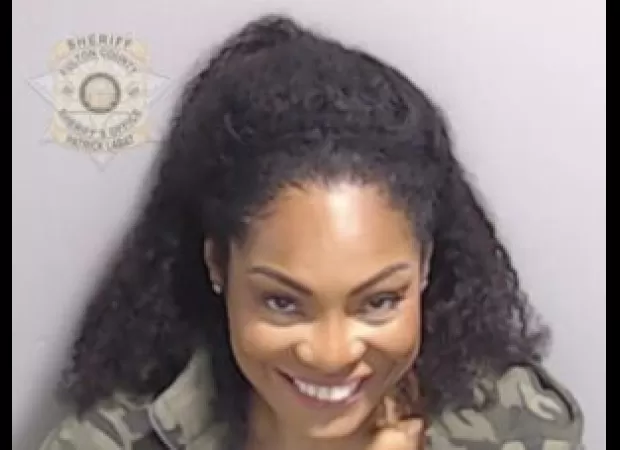 Trevian Kutti, Kanye West's ex-PR, has been indicted in Trump's election fraud case, with their mugshot released.