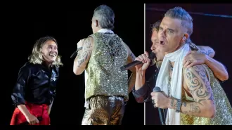Robbie and Mark reunite on stage for the first time in 12 years.