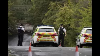 Two people drown after driving into flooded road.