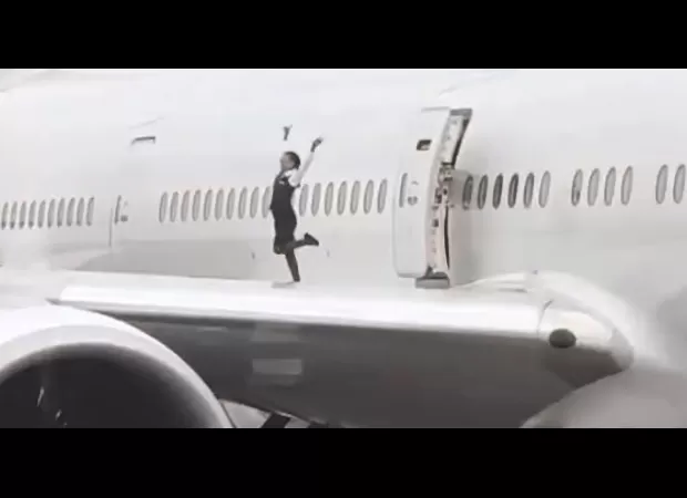 Airline execs outraged after crew members filmed dancing on the wing of a Boeing 777.