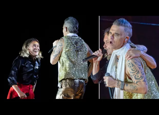 Robbie and Mark reunite on stage for the first time in 12 years.