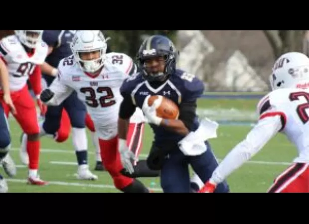 Coach of Atlanta high school football team charged with battery after punching player.