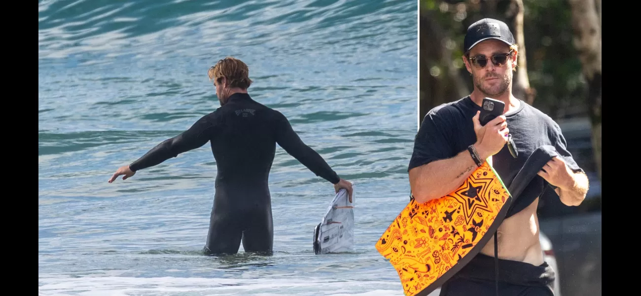 Chris Hemsworth, 40, shows off his toned V-line while getting ready to go surfing in Byron Bay.