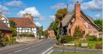 A UK village with picturesque cottages, known as a 