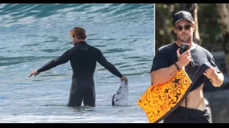 Chris Hemsworth, 40, shows off his toned V-line while getting ready to go surfing in Byron Bay.