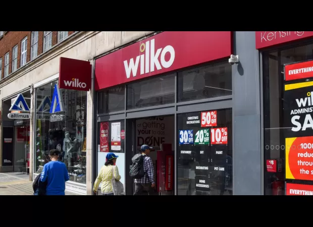 Ex-CEO defends large payments to owners before company's downfall.