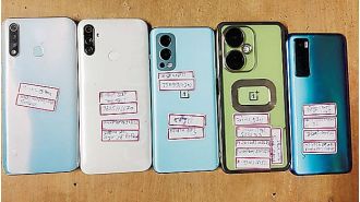 Three people, including a minor boy, arrested for possessing 12 mobile phones.