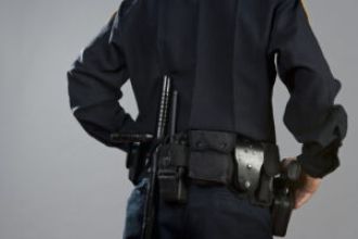 Officer suspended after video showed him kissing and entering backseat with woman.