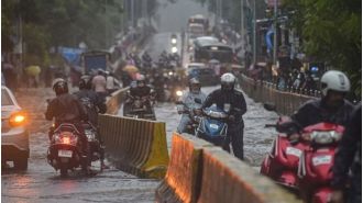 Mumbai hit with heavy rains, causing traffic chaos and waterlogged streets.