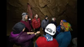 Rescuers start to save man ill 3,000ft underground in cave.
