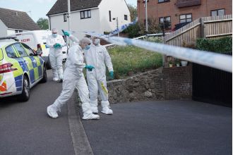 Woman arrested for murder after police expressed concern for two people in a residence.