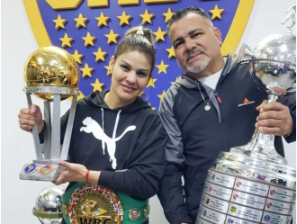 Boxing coach dies of heart attack during wife's world title fight; tragedy described as 