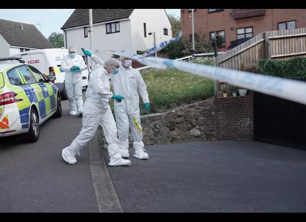 Woman arrested for murder after police expressed concern for two people in a residence.