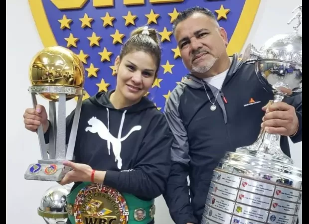 Boxing coach dies of heart attack during wife's world title fight; tragedy described as 