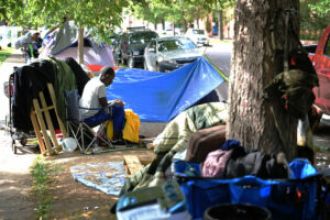 Police investigating pop-up bar at homeless encampment in Denver.