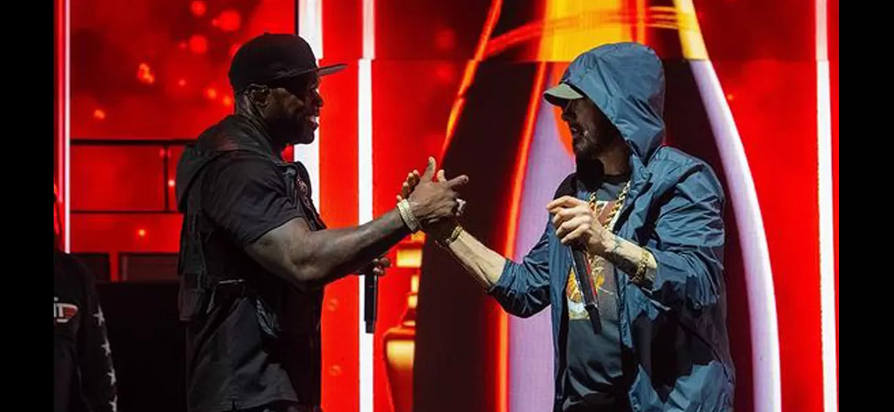 50 Cent brings Eminem on stage in surprise, proclaiming his love for him.