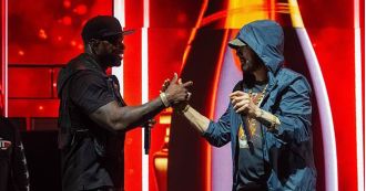 50 Cent brings Eminem on stage in surprise, proclaiming his love for him.