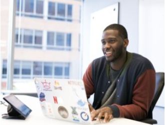 Norbert Powell finds joy in work and life, prioritizing this in his work as a Capital One engineer.