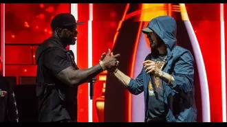 50 Cent brings Eminem on stage in surprise, proclaiming his love for him.