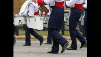 Video shows Alabama band director tased after refusing to end performance despite police orders.