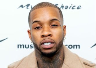 Tory Lanez is in state prison with a new look.
