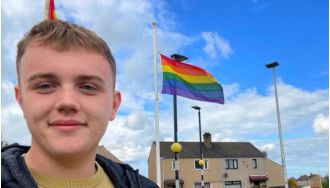 Young councillor faced intense hatred for giving school a pride flag.