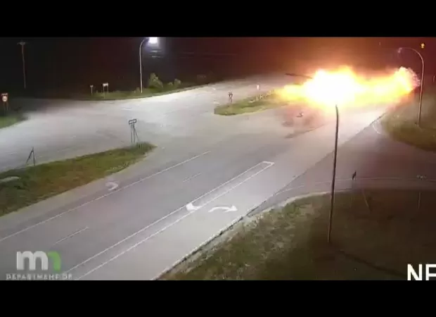 Driver escapes car crash with minor injuries after car is flattened and bursts into flames.