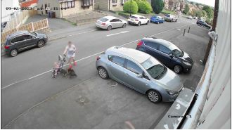 Mum defends her pet and baby from a dog's attack, shielding them both.