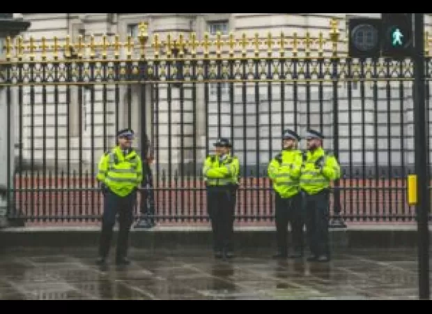 Police in London turned in their guns after an officer was charged with murder.