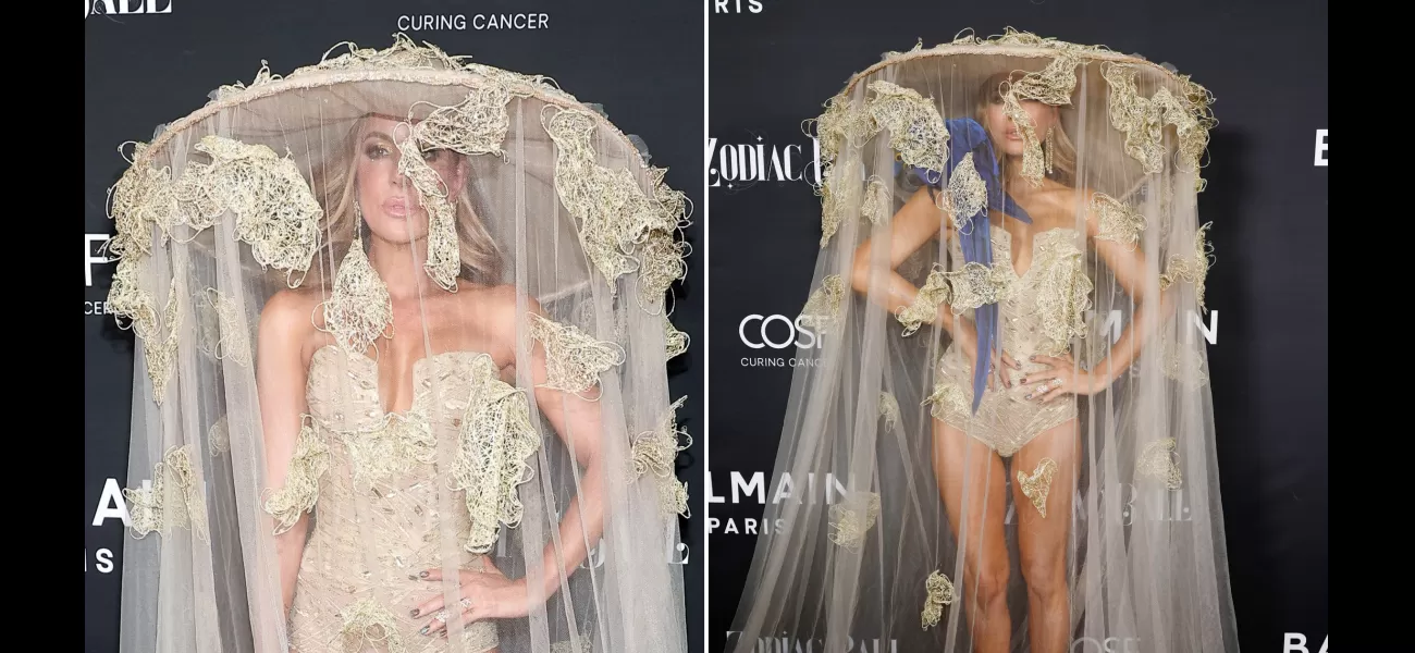 Kate Beckinsale stuns in a revealing bodysuit and huge hat at the Balmain Zodiac Ball.
