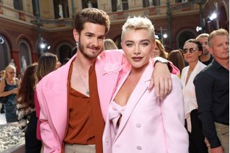 Florence Pugh and Andrew Garfield were spotted having fun at the Valentino Paris Fashion Week show.