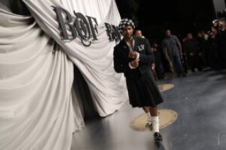 People online responded to Usher's fashion statement of wearing a kilt in Paris.