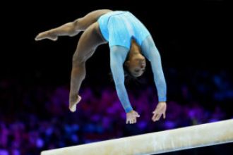 Simone Biles made history at the World Championship Qualifier with her impressive gymnastics accomplishments.