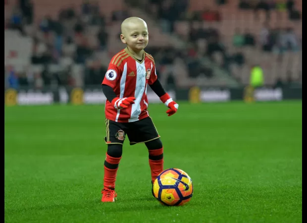 Man charged for mocking 6-year-old cancer patient during a football game.