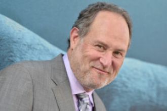 Director Jon Turteltaub discusses Disney's Jamaican accent controversy on the 30th anniversary of 'Cool Runnings'.