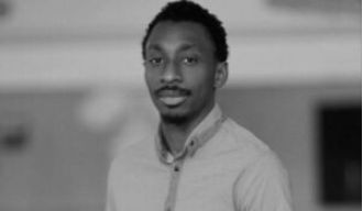 Family of African student slain in Russia seeking answers; suspect denies association with white supremacy group.
